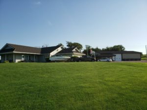 Exterior of House with Metal Garage Summer
