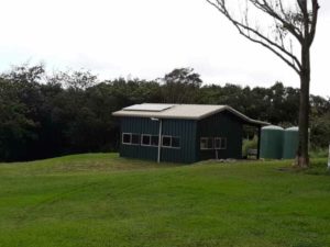 Black Storage Building with Overhang