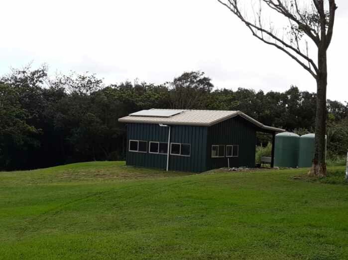 Black Storage Building with Overhang