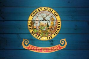 Official seal of the State of Idaho on a blue background