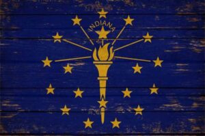 Indiana state flag on distressed blue wooden planks