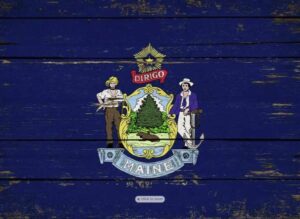Maine state flag emblem on rustic blue wooden background