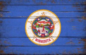Minnesota state flag on distressed blue wooden planks
